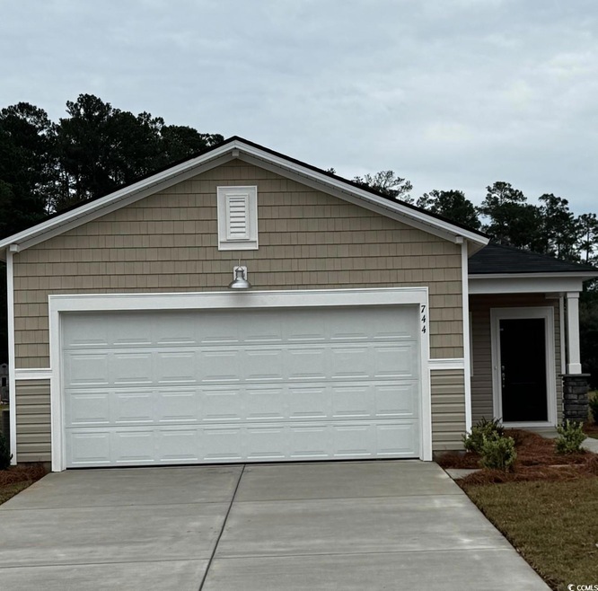 View of front of property with a garage