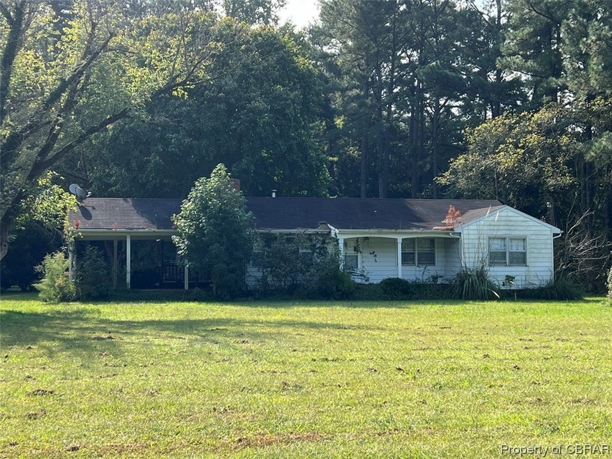 Single story home featuring a front yard
