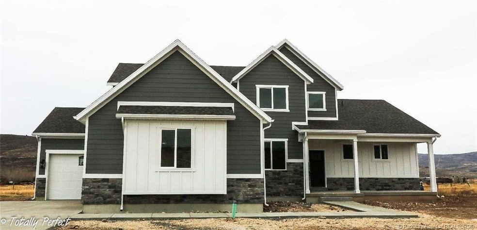MODERN THREE CAR GARAGE TWO STORY HOME I