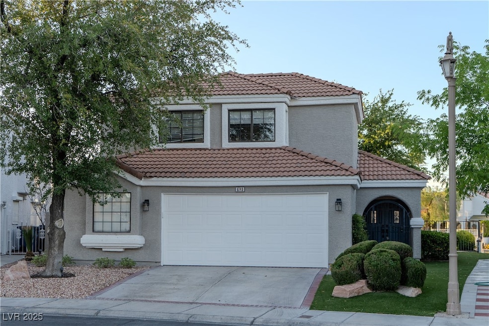 Mediterranean / spanish home with a tile roof, con