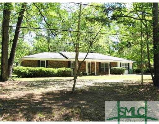 Exterior Front. Surrounded by trees and shrubbery 
