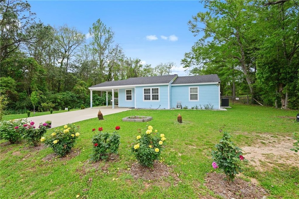View of front of home with an attached carport, dr