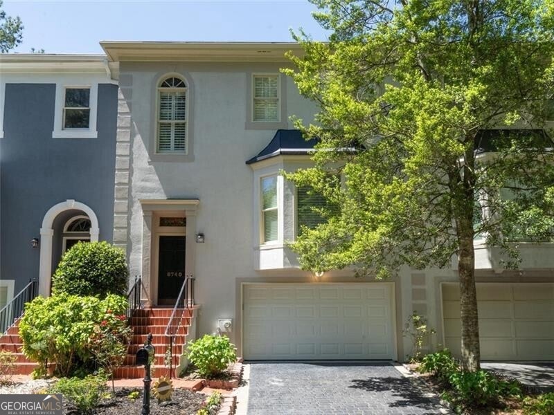 View of front of house with a two car garage