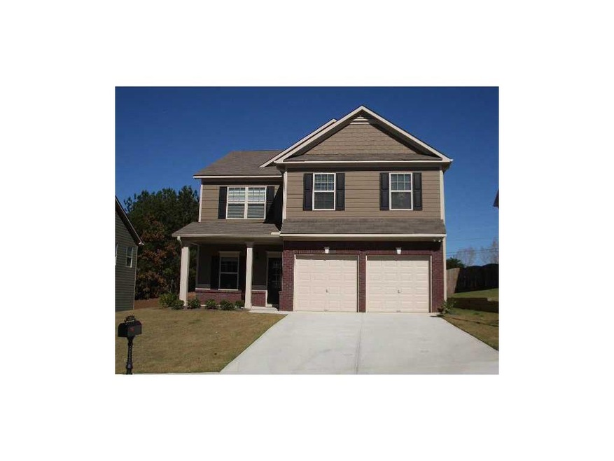 Exterior Front. Photo is example of finished plan 