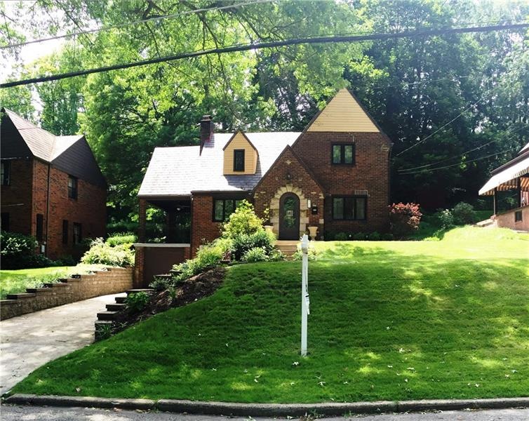 Beautiful treed street and professionally landscap
