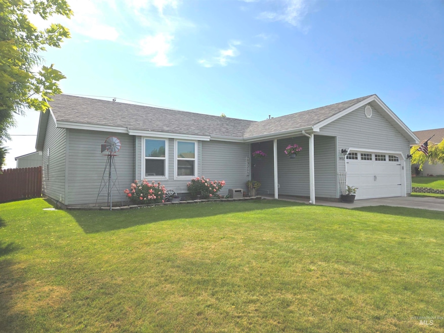Single story home with a garage, concrete driveway, and a shingled roof