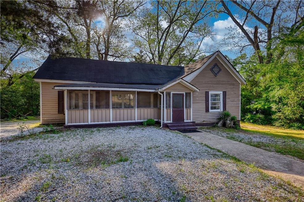 Ranch-style home with a sunroom and roof with shin