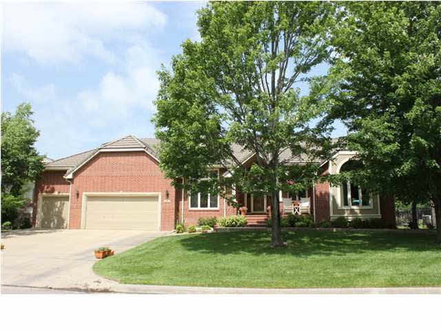 Elegant & Inviting curb appeal. Brick with Stone a