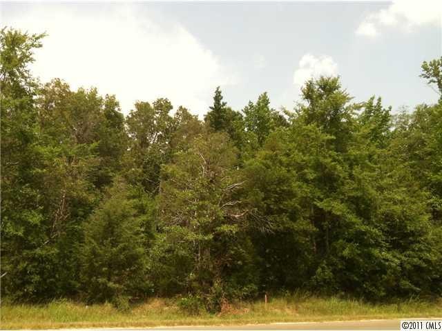 Exterior Front - Front views of three wooded lots 