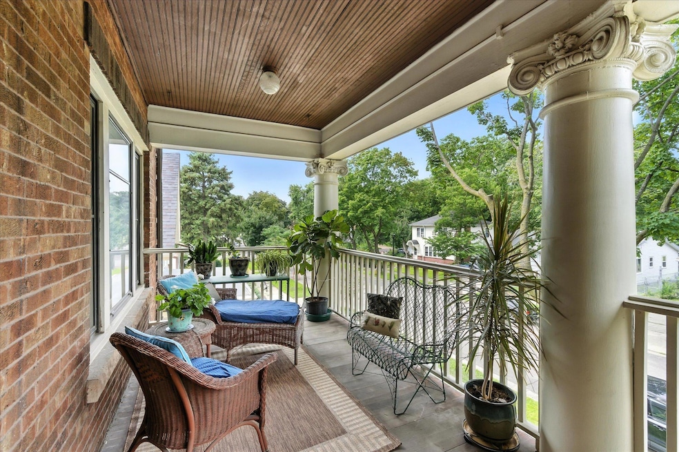 This is YOUR own veranda, perfect for a morning cup of coffee or full workday. Note the original bead board ceiling and elegant pillars that characterize the Pullman style condos of the1900's.All of this in the heart of popular Northeast Minneapolis.