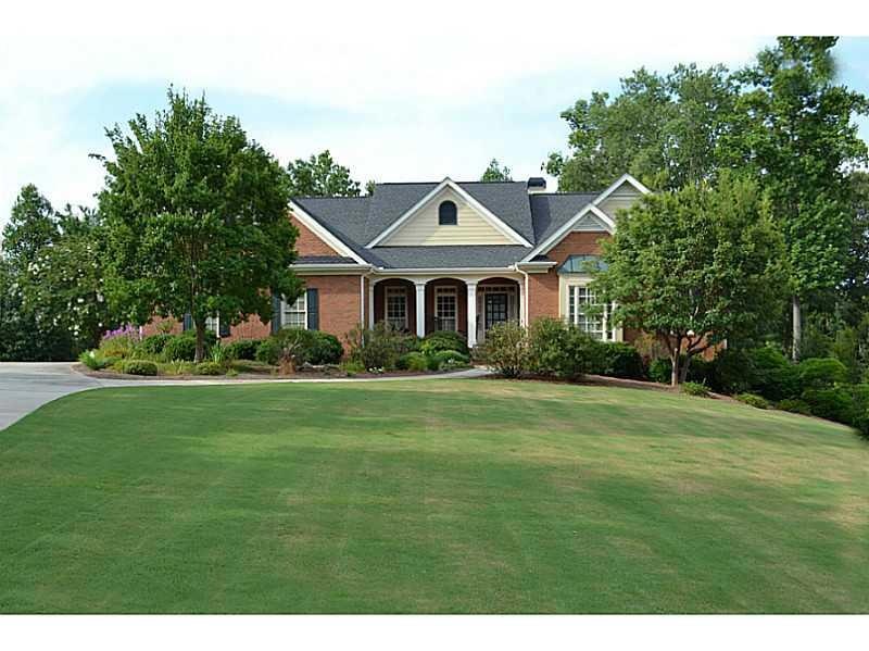 Exterior Front. Pristine Brick home with rocking c