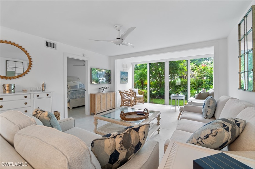 Living room featuring ceiling fan