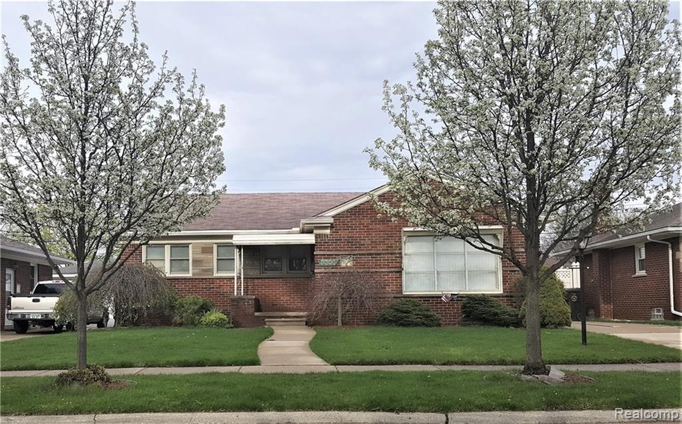 Front elevation with 2 bradford pear trees.
