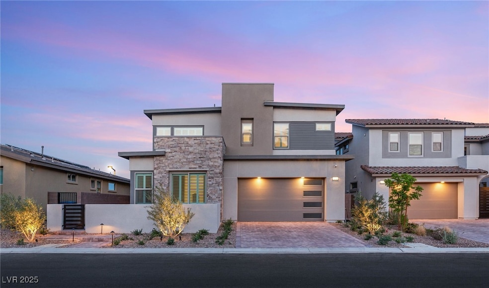 View of front of home with stone siding, stucco si