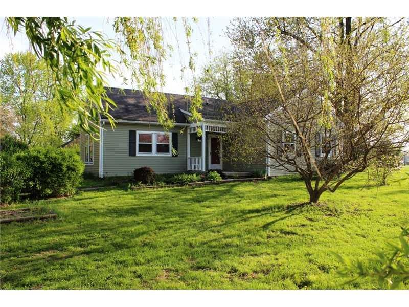 Exterior Front. Welcome home nestled on a .92 acre lot surrounded by beauitful mature trees and landscaping.  In the middle of town life close to all you need but you feel like you re out in the country.  Siding and soffits new in 2011, gutters new i