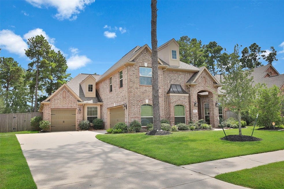 THREE CAR GARAGE:  Blended perfectly with the architecture of the home, this property features a three attached garage, with one single bay and a double bay.  Coach lights that echo those at the front entry accent the garage door.   Everything about this property says 