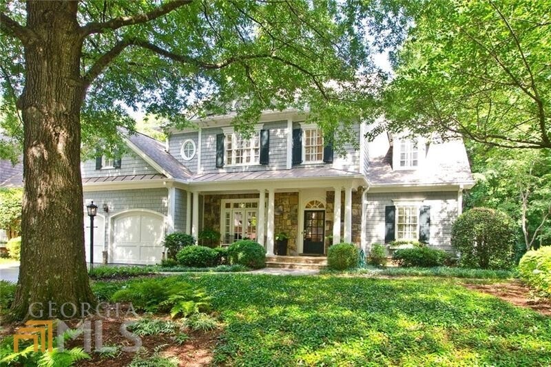 This charming shingle and stone  home was built by