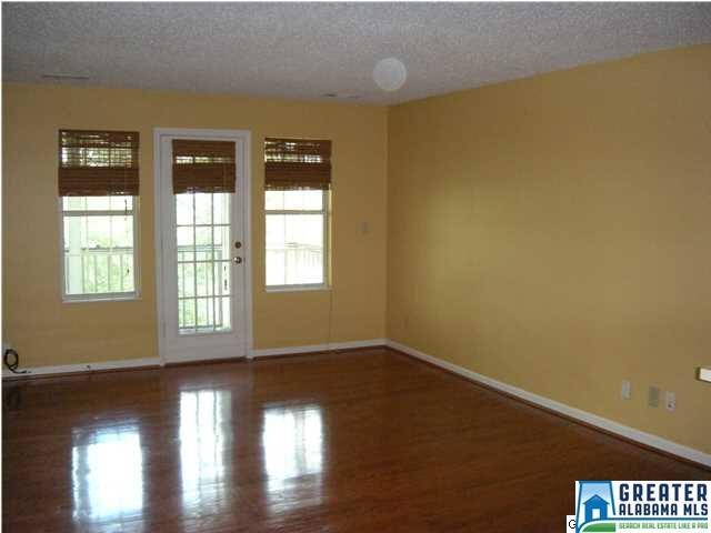 Large great room with built in shelving, hardwood 