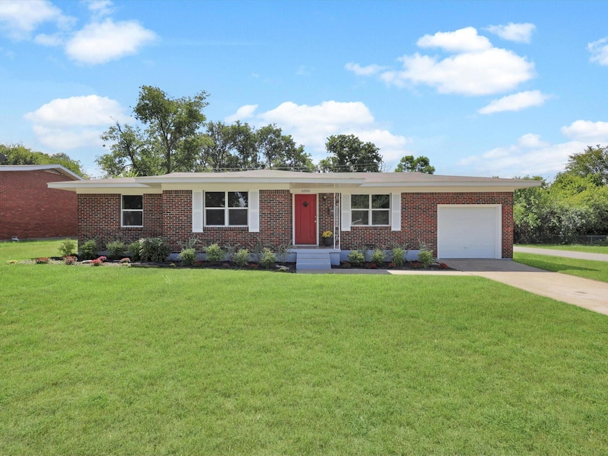 Single story home featuring a front yard with upda