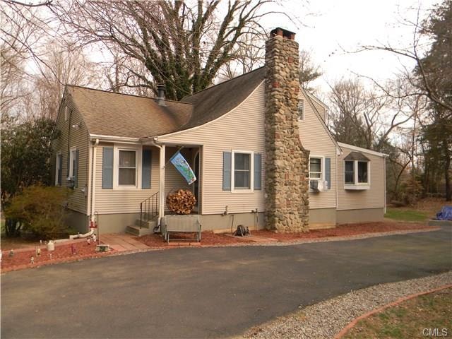 FRONT SHOWING STONE CHIMNEY