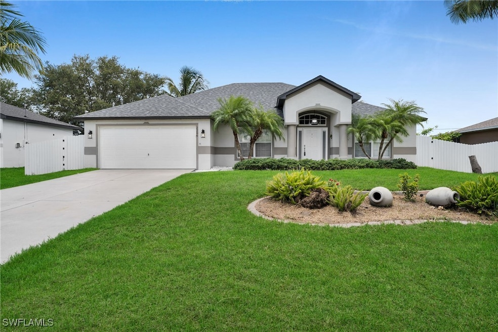 Ranch-style house with a garage, concrete driveway