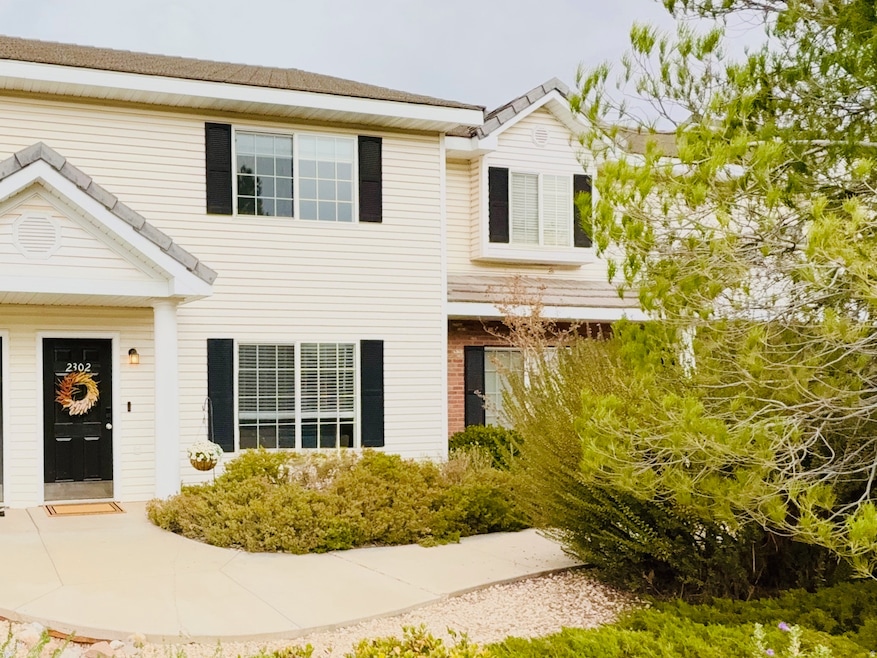 Pretty elevation welcomes guests as they walk on path from parking area.