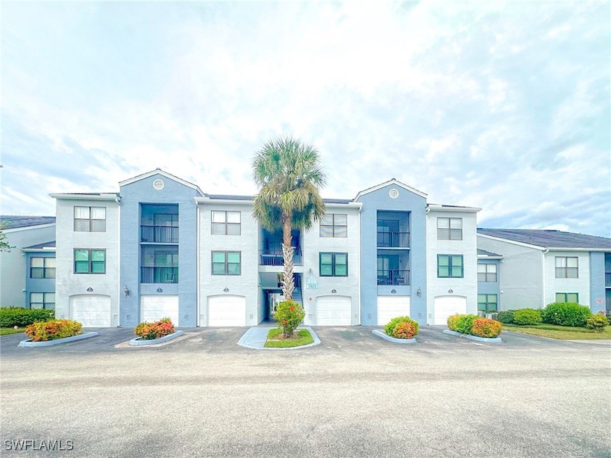 View of front of home featuring driveway and a garage