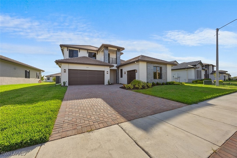 Prairie-style house featuring a front lawn, decora