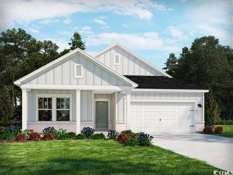 Modern farmhouse with brick siding, a garage, conc