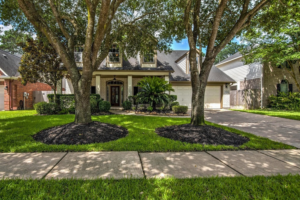 Welcome to 15819 Augustin Landing! Nicely landscaped and great front porch.