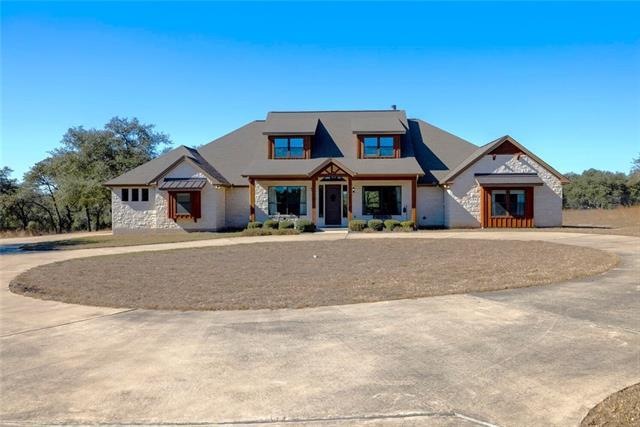 From gated driveway nestled in heavily wooded front of property which provides privacy!  Once you drive in, you will be created by a circle driveway and a grand entrance!