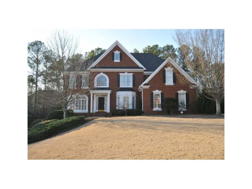 Exterior Front. Stunning four-sided brick executiv