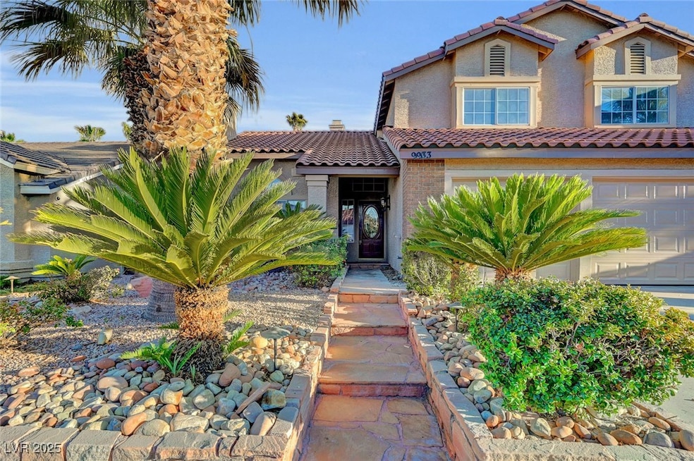 Mediterranean / spanish home featuring a tiled roof and stucco siding