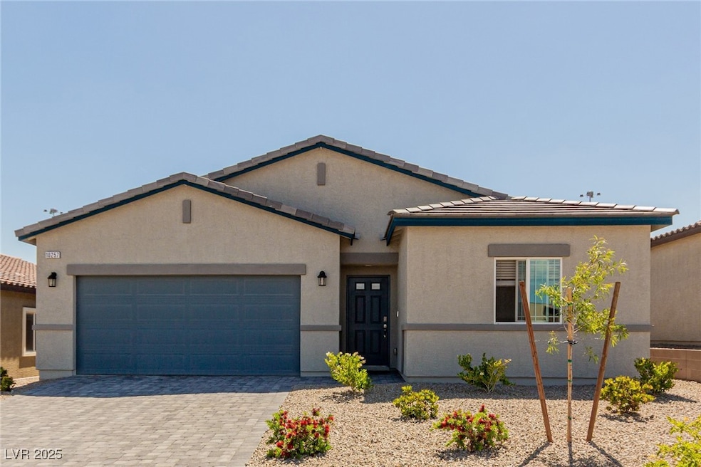 View of front facade featuring a garage, decorativ