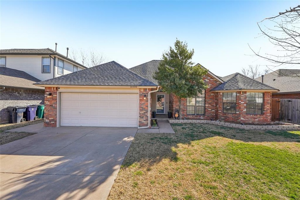 Ranch-style house with an attached garage, a shing