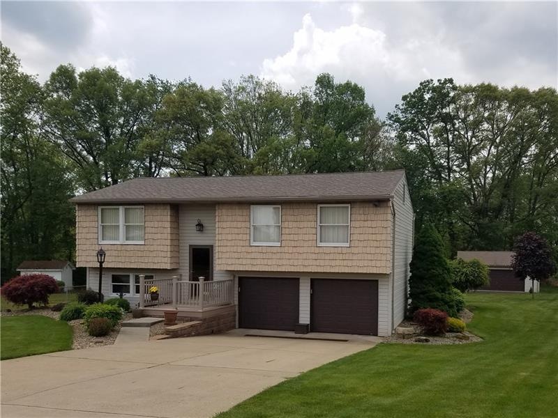 Front of the home with showing the detached garage