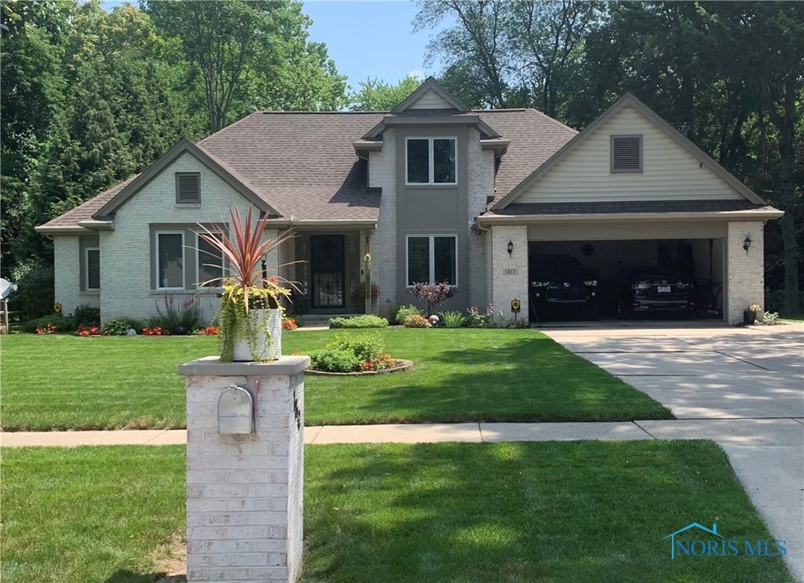 Summer photo with gorgeous landscaping.
