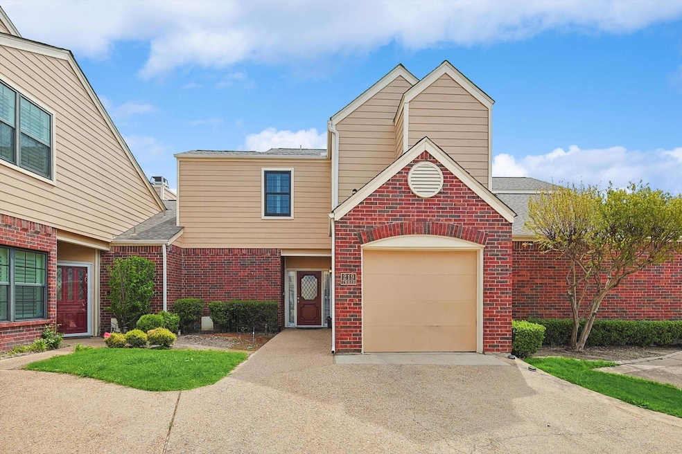 View of front facade featuring a garage