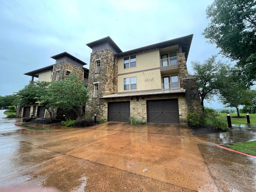View of front facade featuring concrete driveway,
