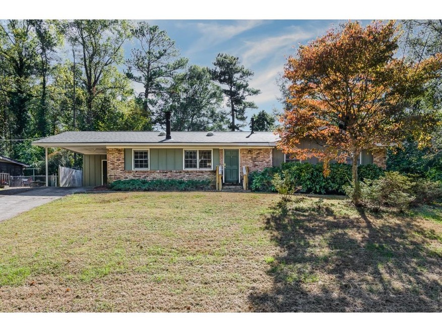 Brick ranch on large level backyard.