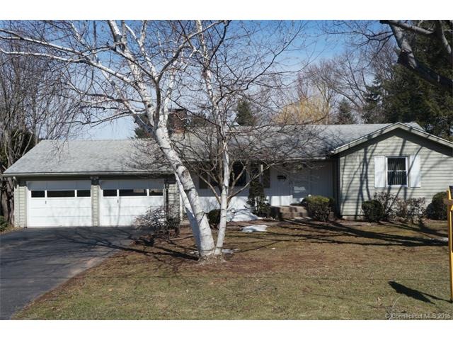 L shaped ranch with 2 car attached garage