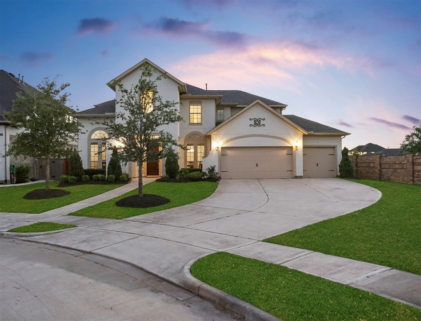 Welcome home to 2502 Stonebury Falls Court located on a quiet cul-de-sac street in Avalon at Spring Green zoned to Katy ISD! This stunning home has lovely curb appeal, a well-manicured lawn, beautiful landscaping, stucco elevation, dark stained front door, beautiful outdoor lanterns, and an extra-wide driveway.