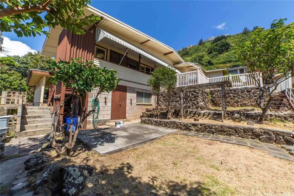Back of the property - Manicured yard and terraced