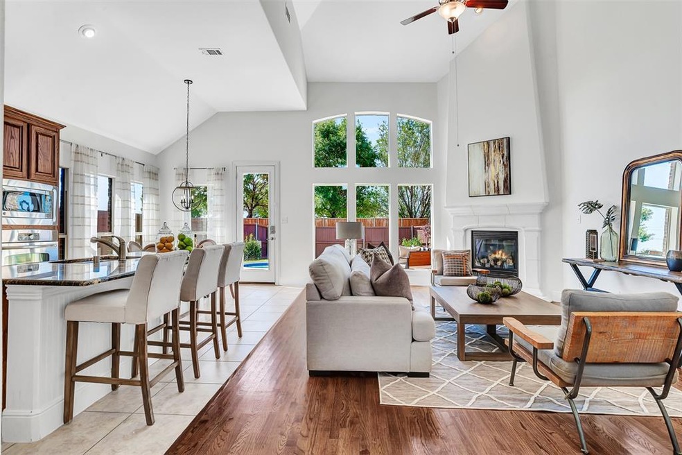 Open concept living and dining overlooks pool & pr