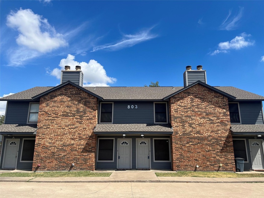 Traditional-style 4 Plex home with  brick siding, 