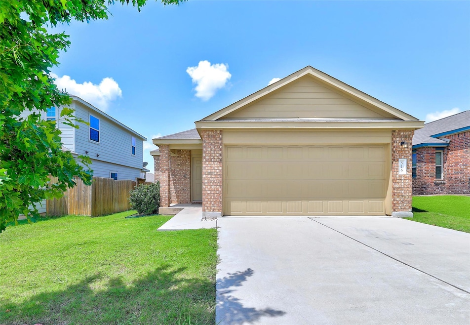 View of front of property with brick siding, conc