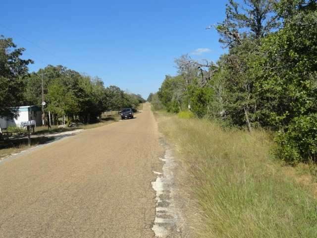 Looking down Milam Road , property on right