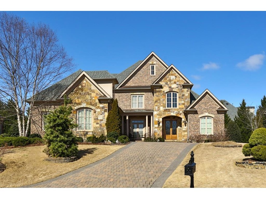 Impeccable brick and stone home on a private cul-d