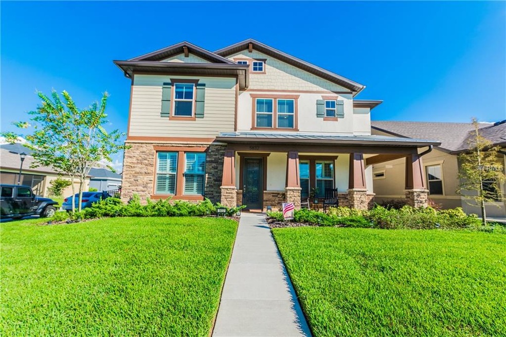 The Pulte Summerfield front elevation features uni