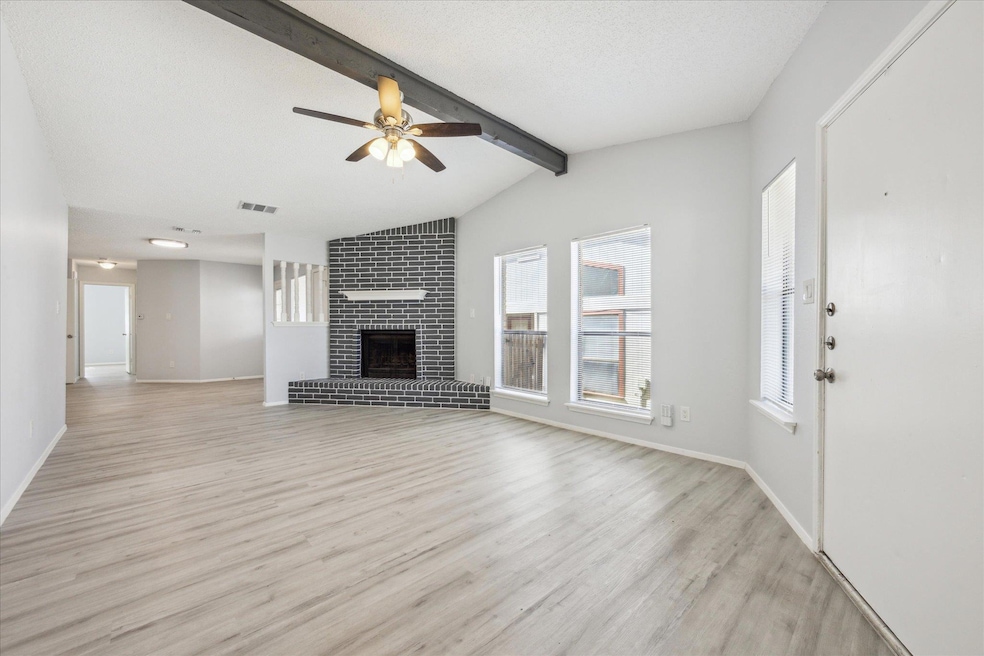 Unfurnished living room with light wood-style flo